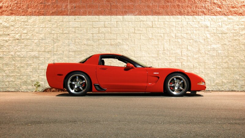 Red Corvette Sports Car — Calm, Afternoon, Photograph, Brick Wall