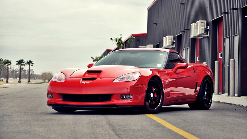 Red Corvette Sports Car — Dramatic, Afternoon, Photograph, Building, Palm Trees