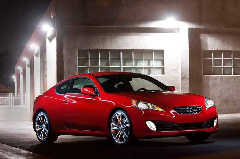 Red coupe at night