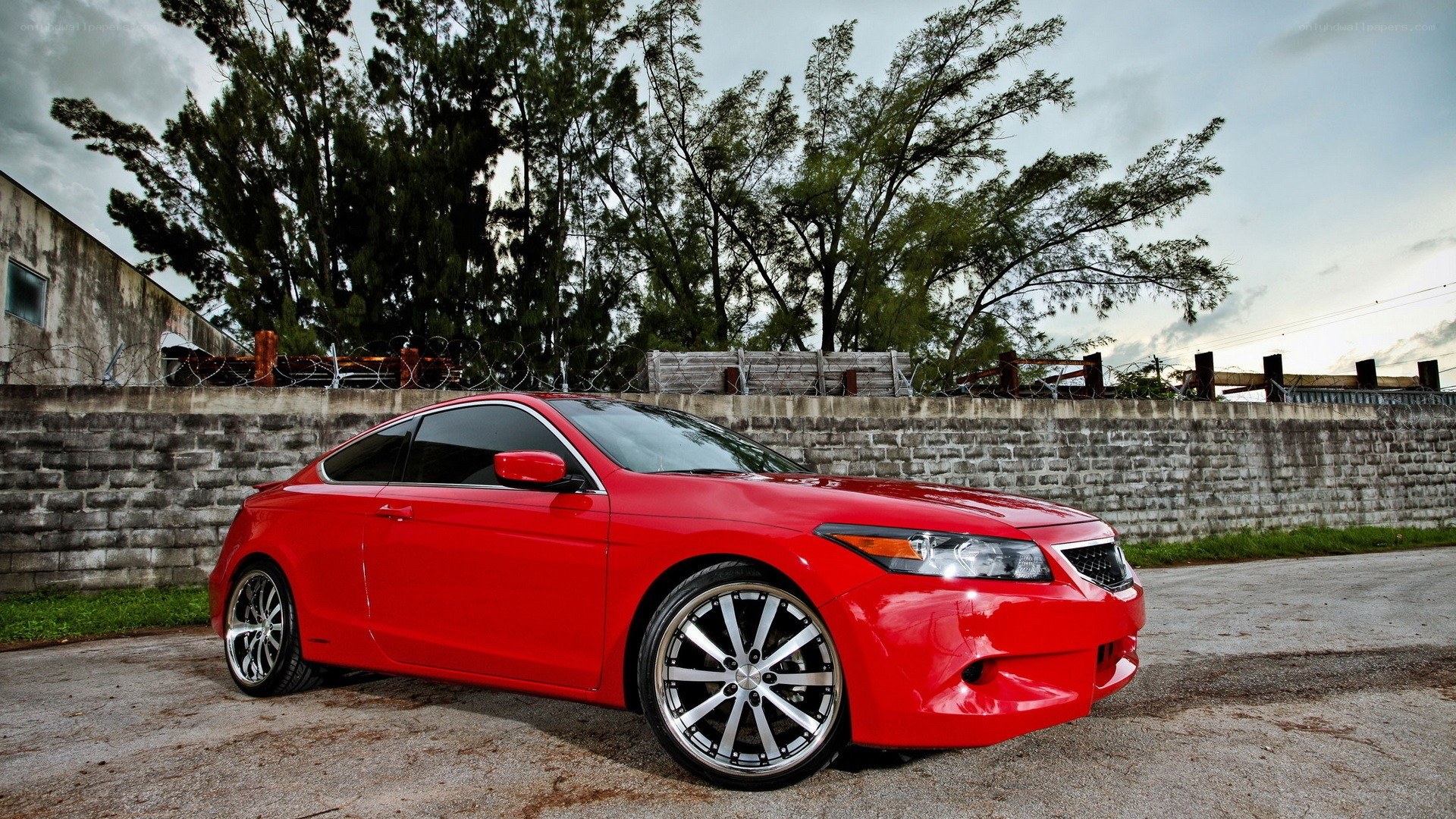 red coupe car on pavement