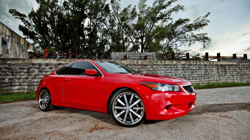 red coupe car on pavement
