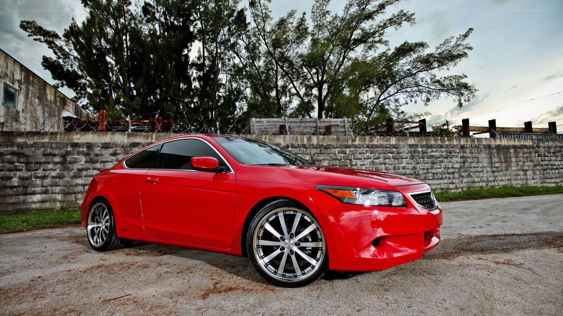 red coupe car on pavement