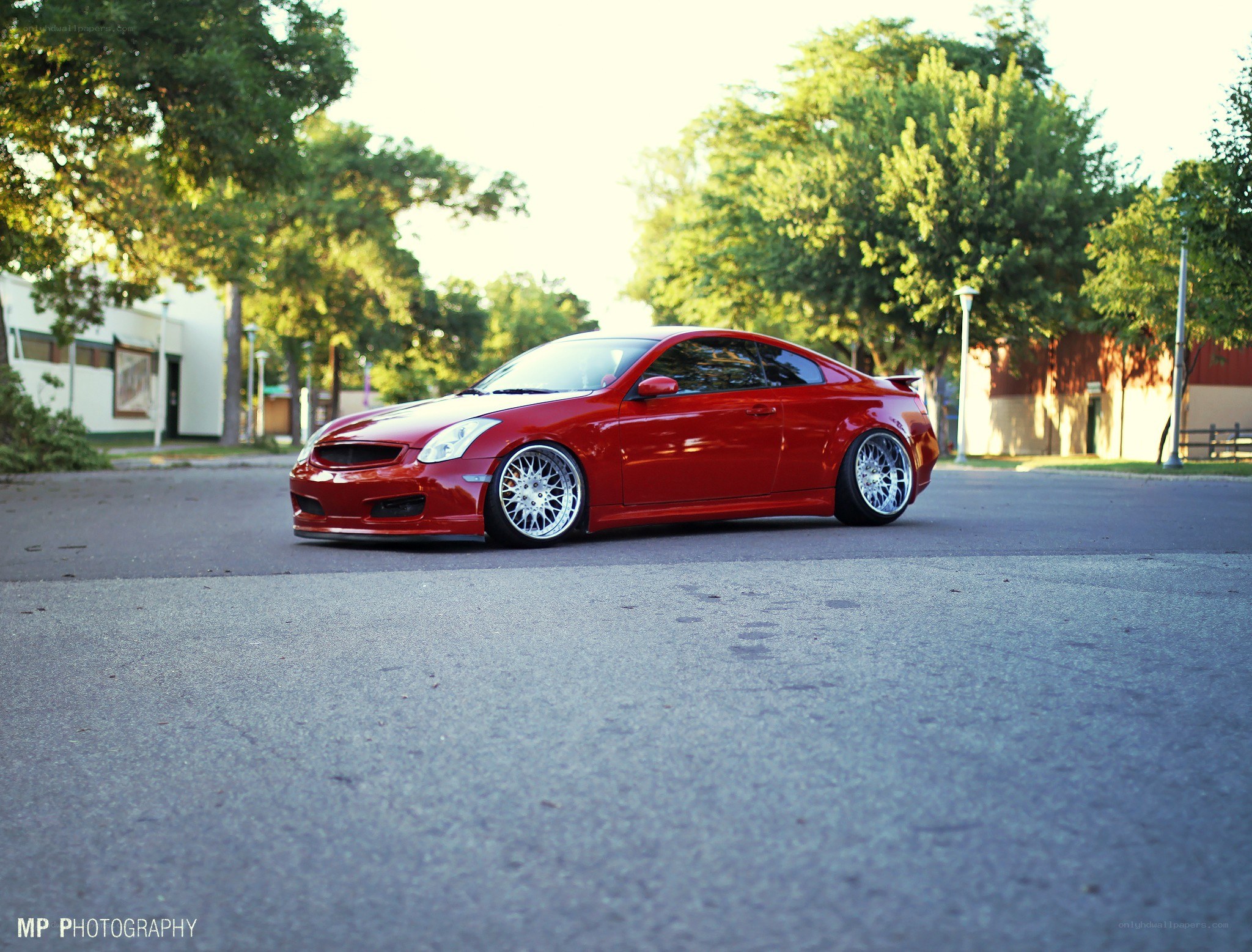 Red coupe on lowered suspension