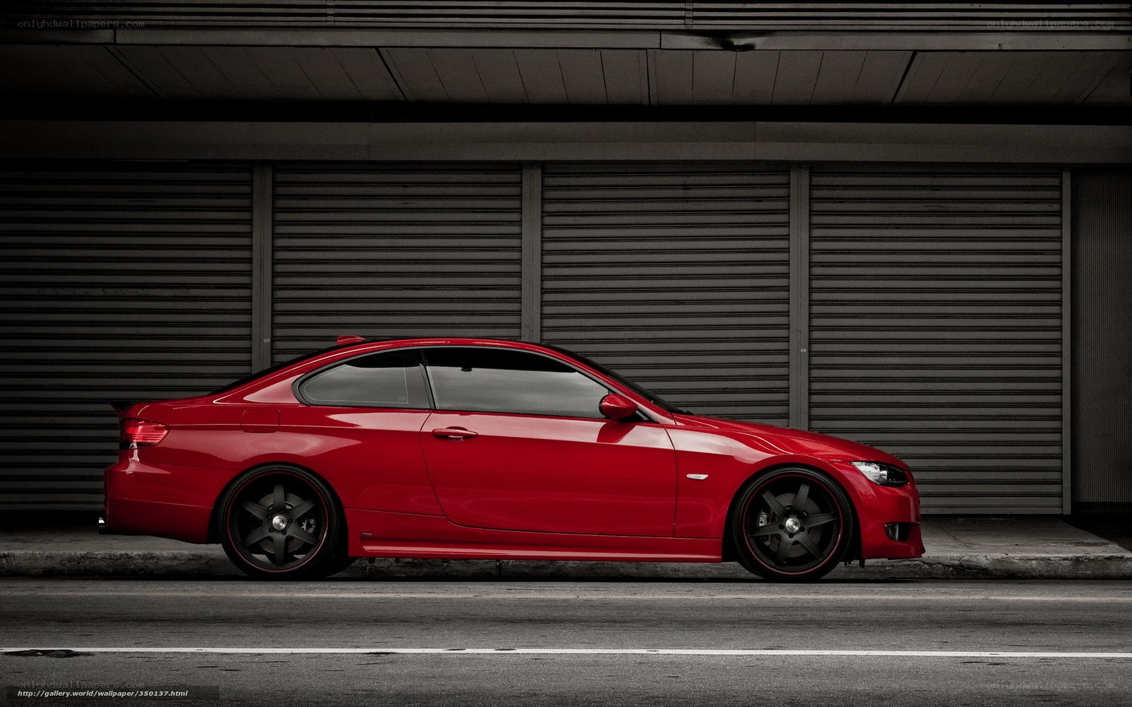Red coupe parked on street