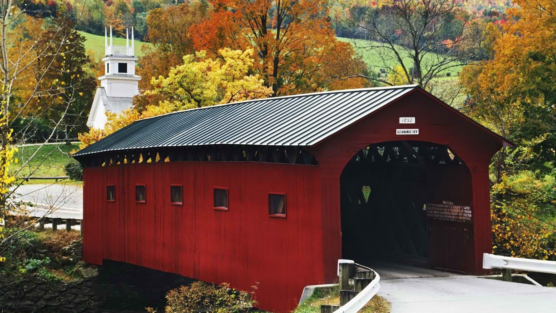 Red covered bridge in autumn