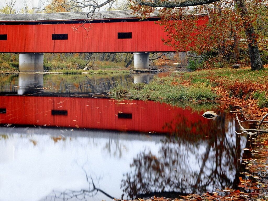 Red covered bridge in autumn