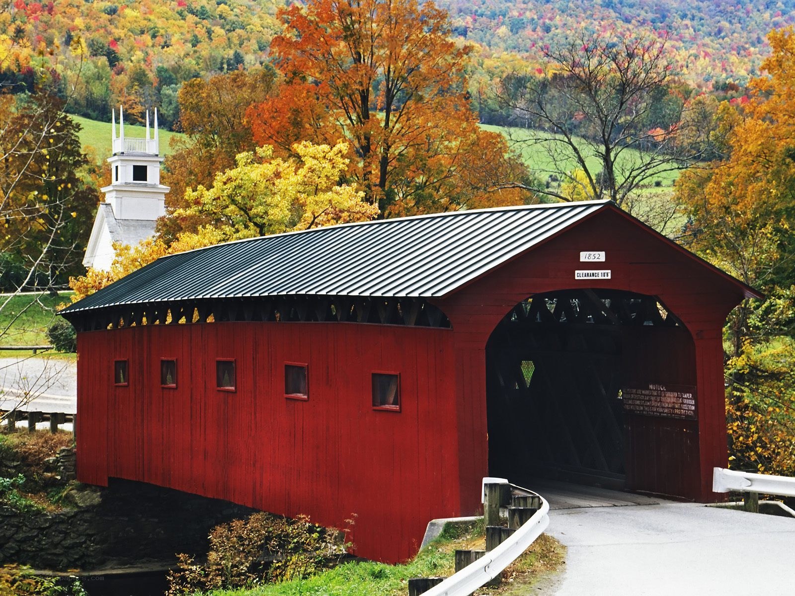 Red covered bridge in autumn