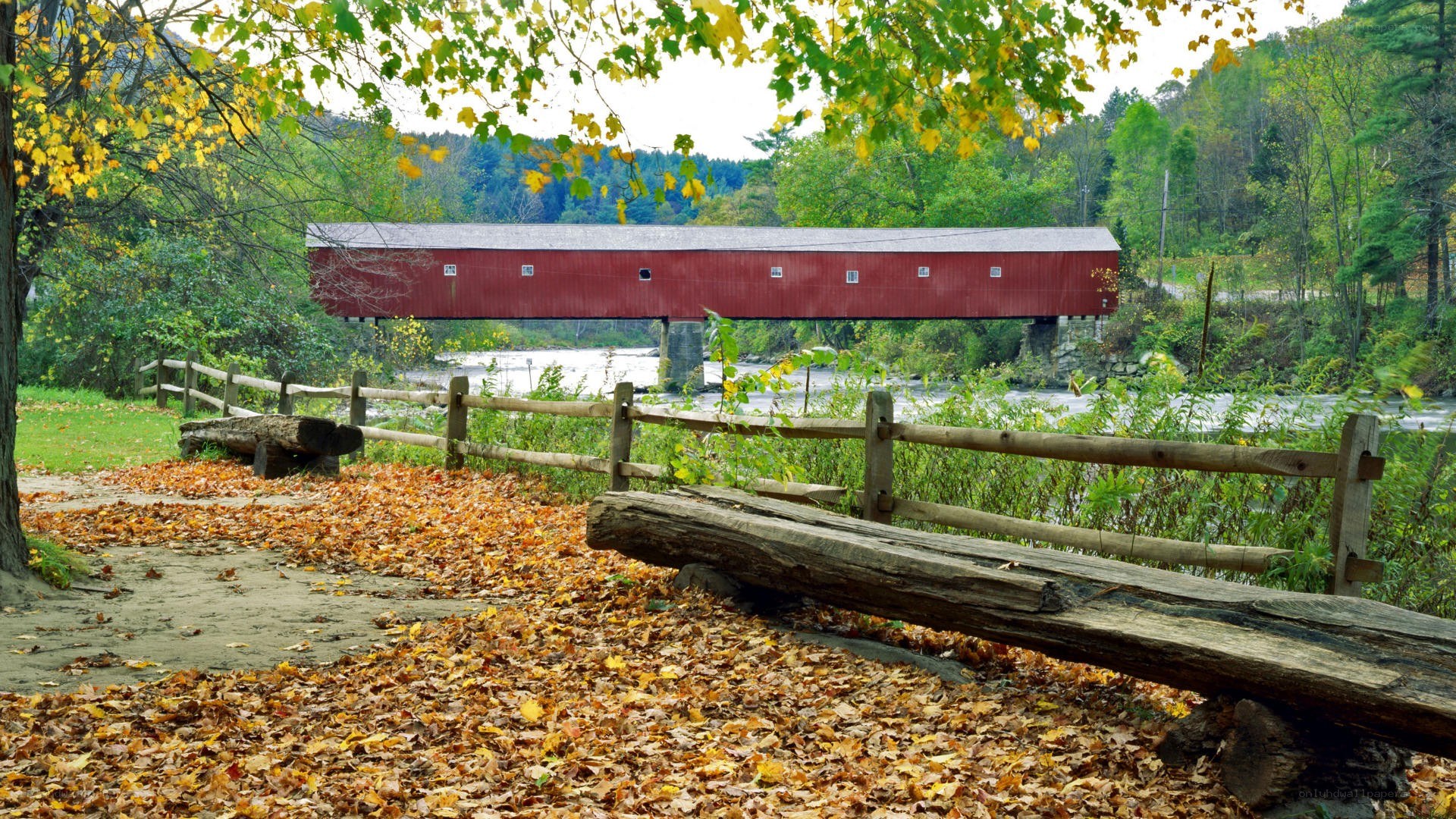 Red covered bridge in autumn