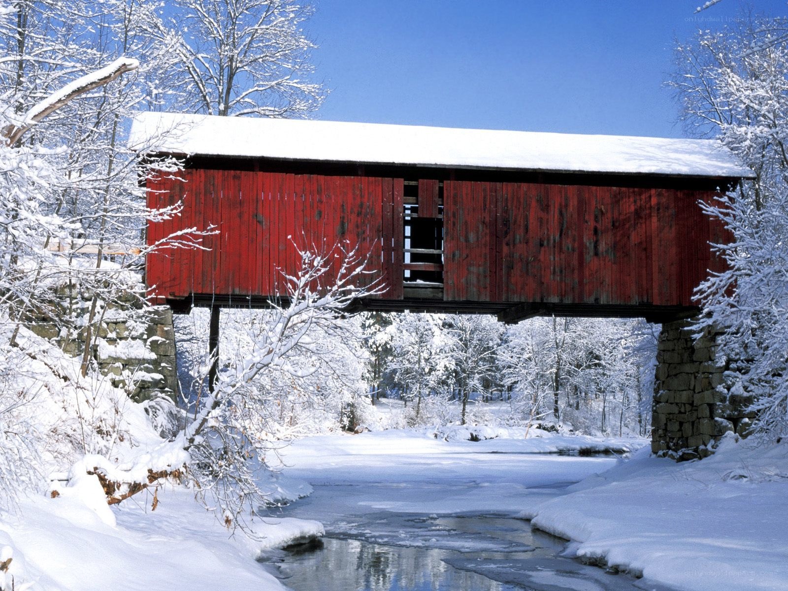 Red covered bridge in winter