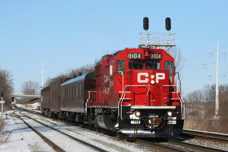 Red CP train on snowy tracks