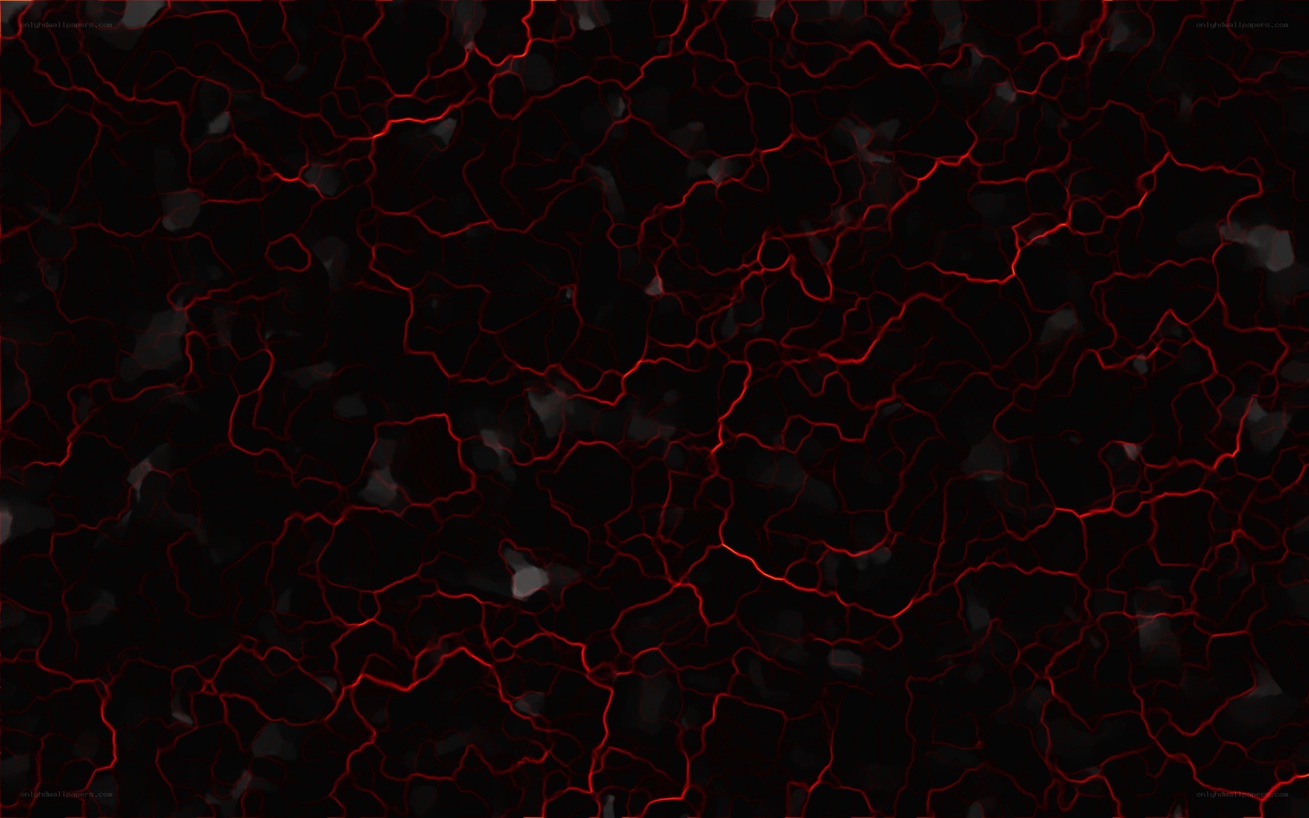 Red cracks on black surface