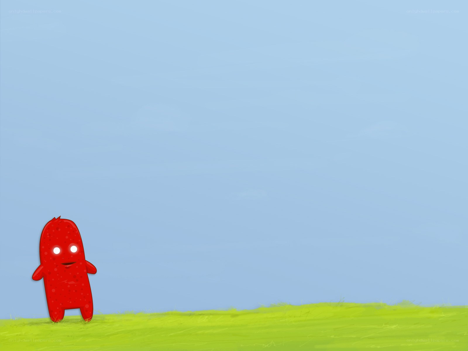 red creature on green field