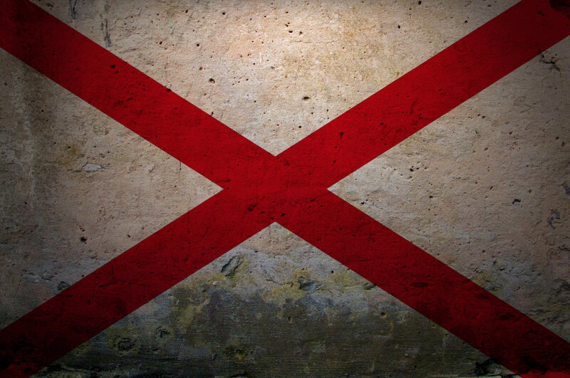 red cross on concrete wall