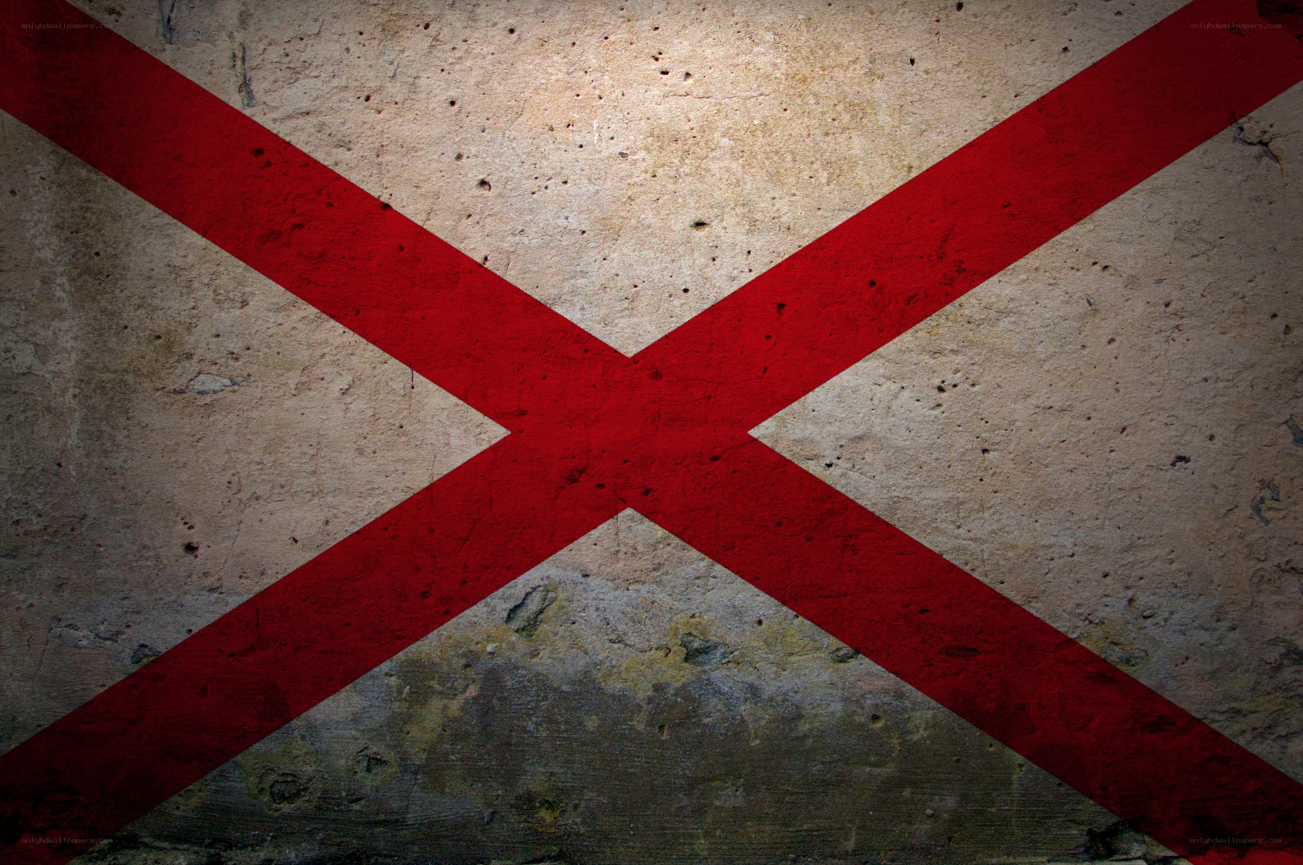 red cross on concrete wall
