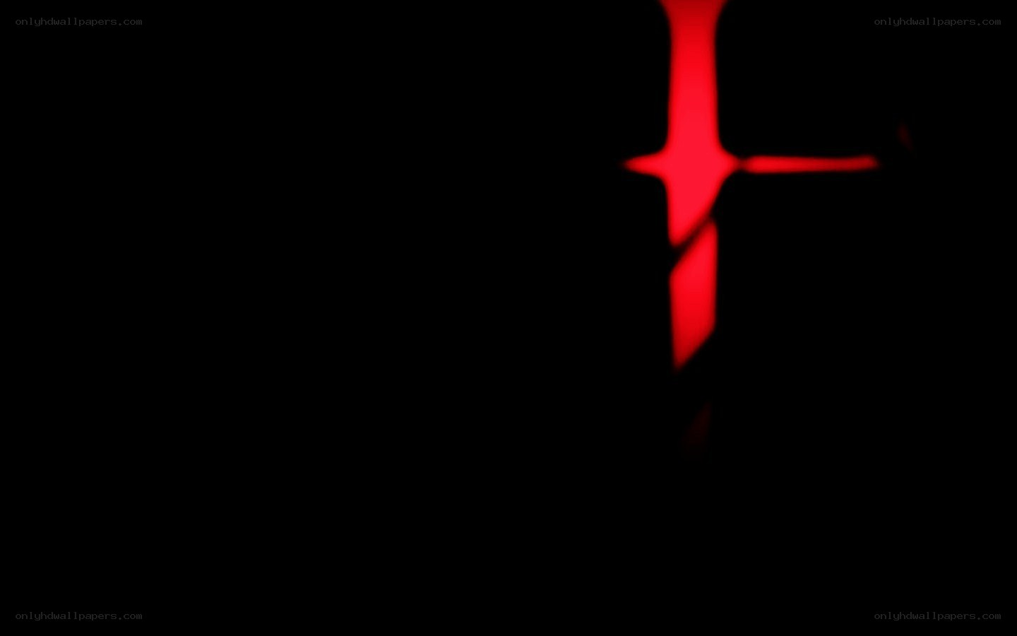 red cross symbol in darkness