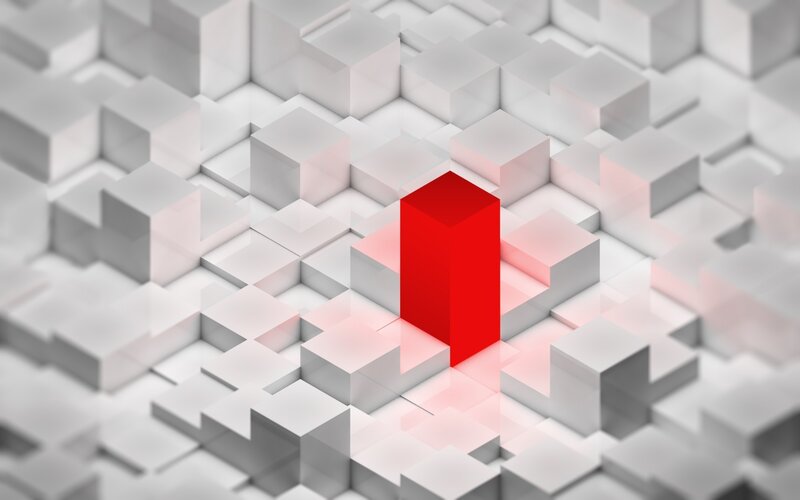 Red cube in a grid of white cubes