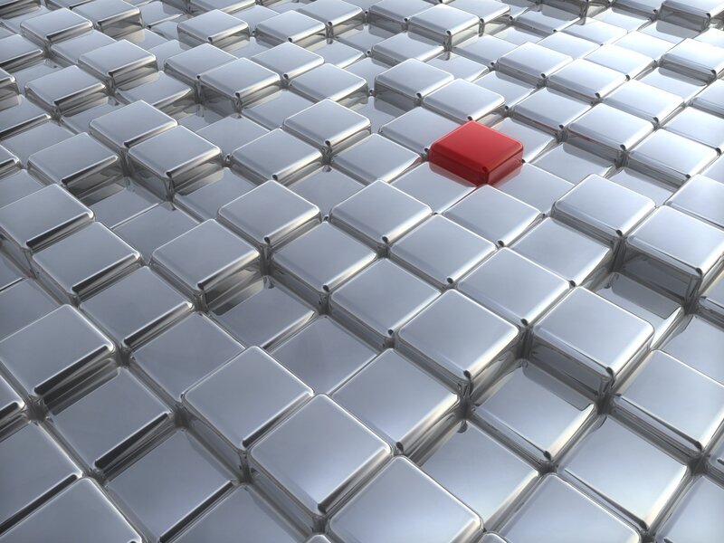 red cube on silver tiles