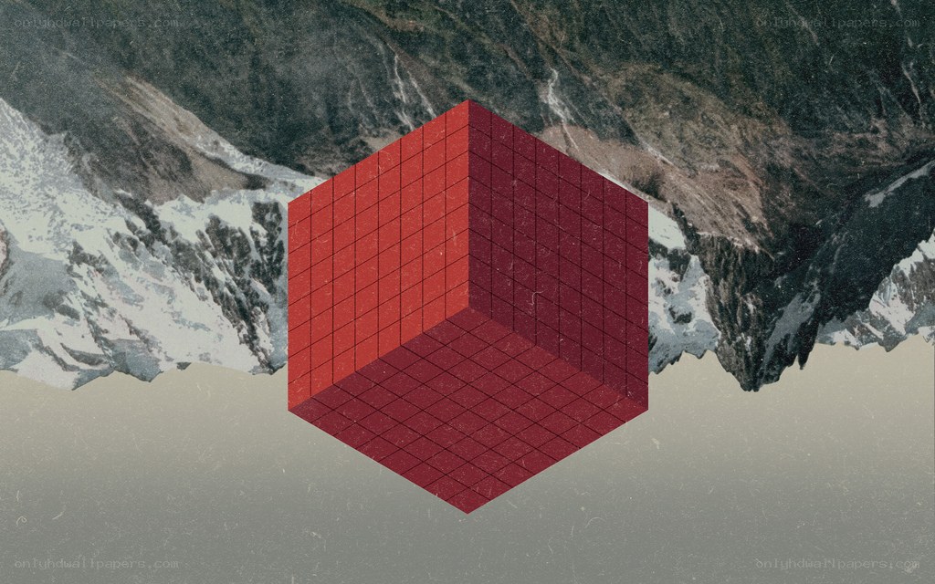 Red cube over mountains
