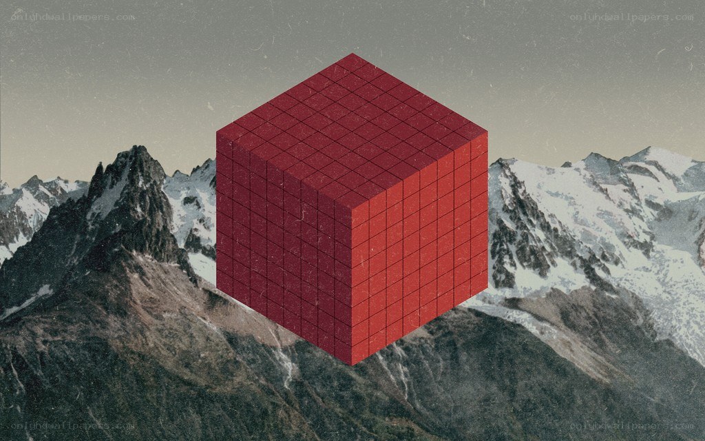 Red cube over snowy mountains