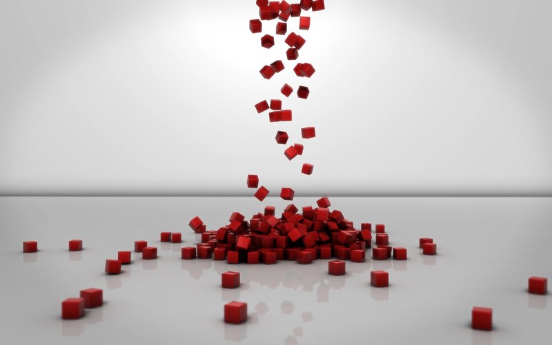 Red cubes falling on white surface