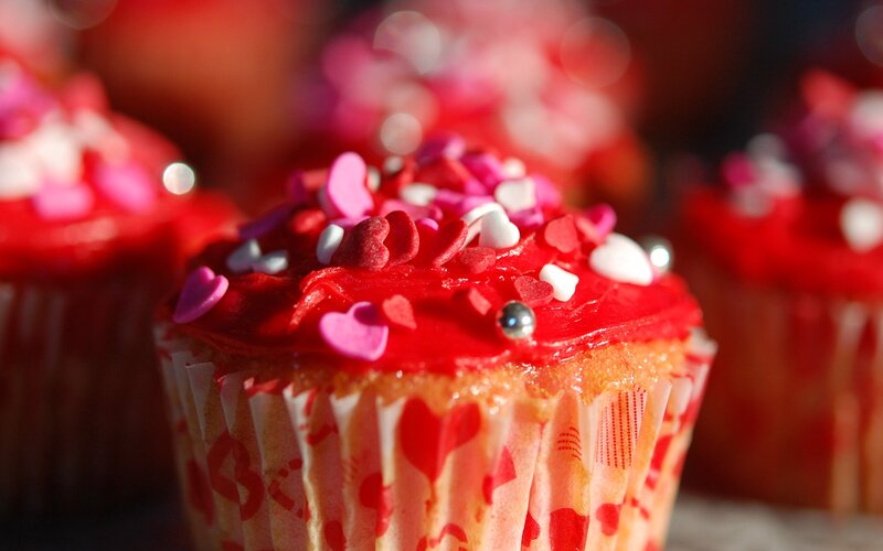 Red cupcakes with heart sprinkles