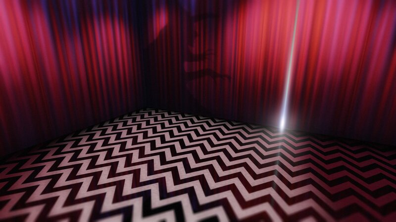 Red curtain room with zigzag floor