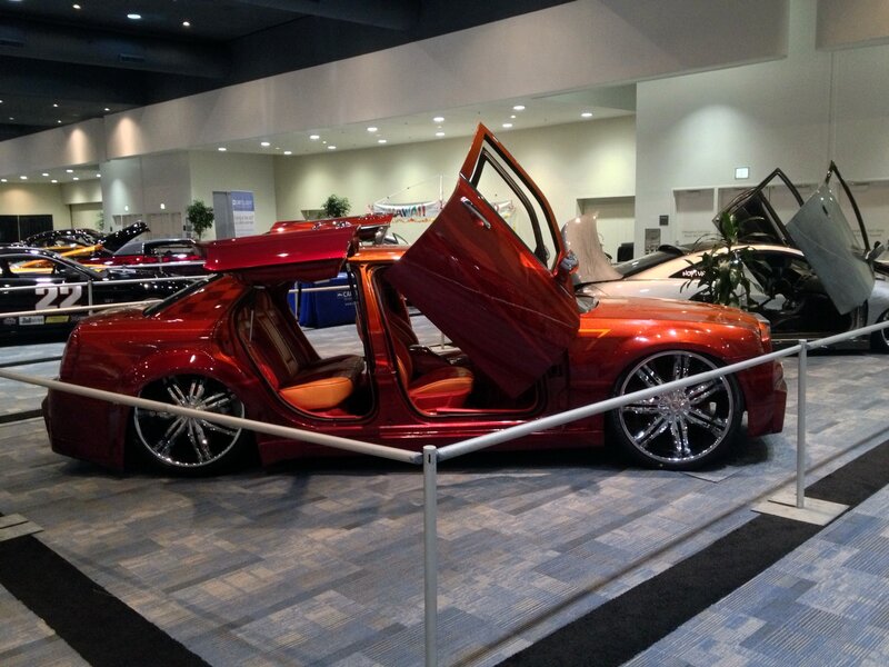 Red custom car with gull-wing doors