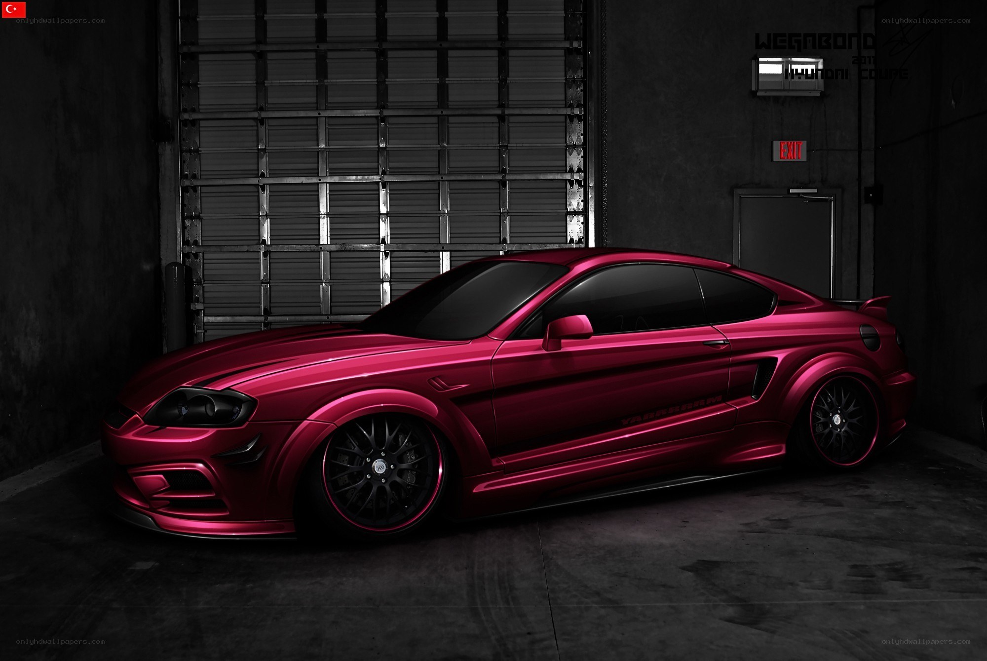 Red custom coupe in garage