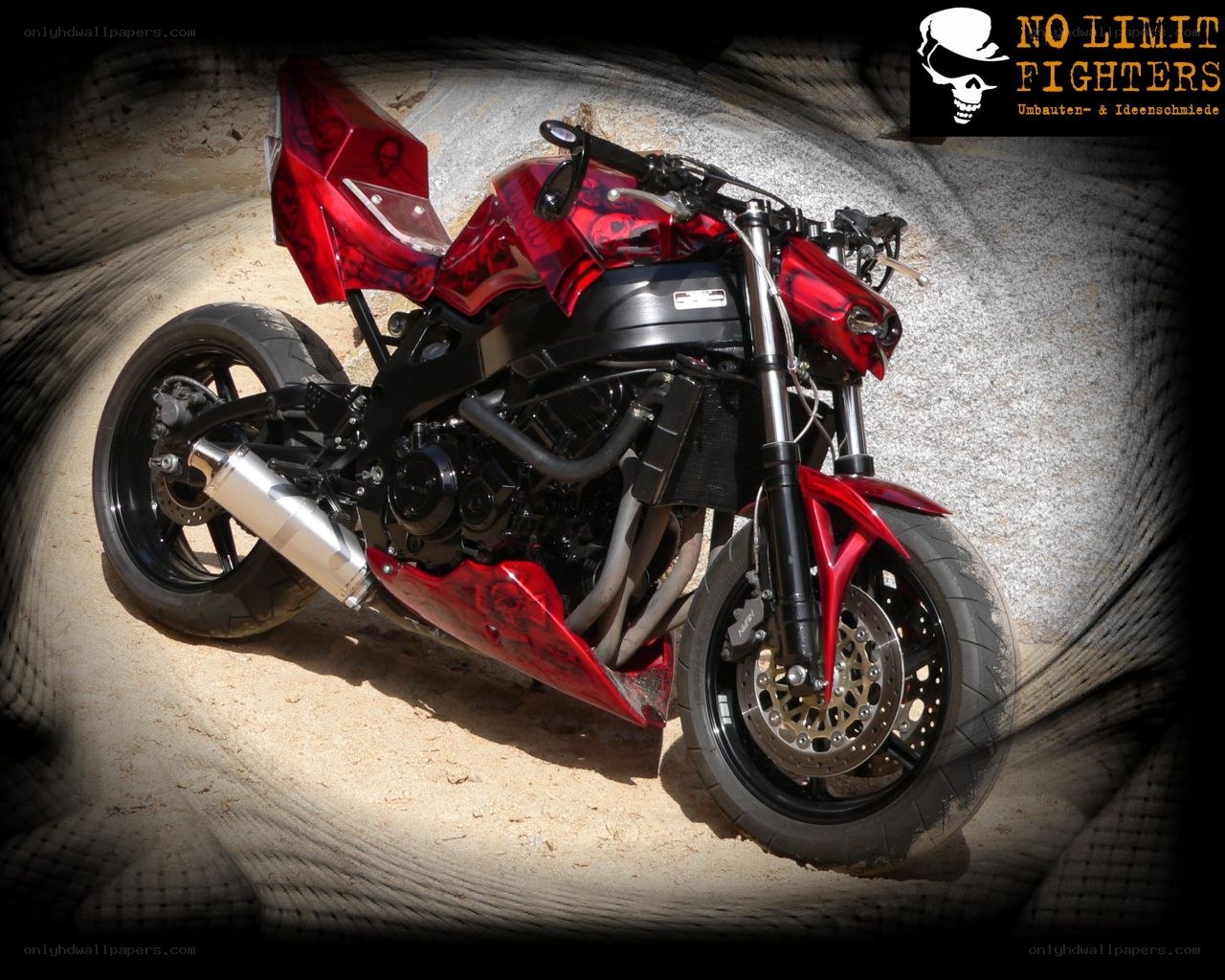 red custom motorcycle with skull graphics
