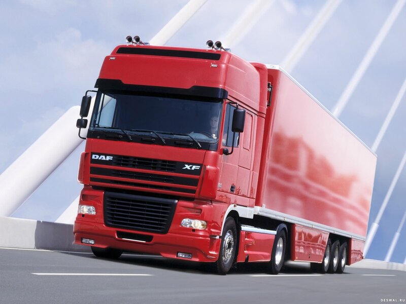 Red DAF XF truck on bridge