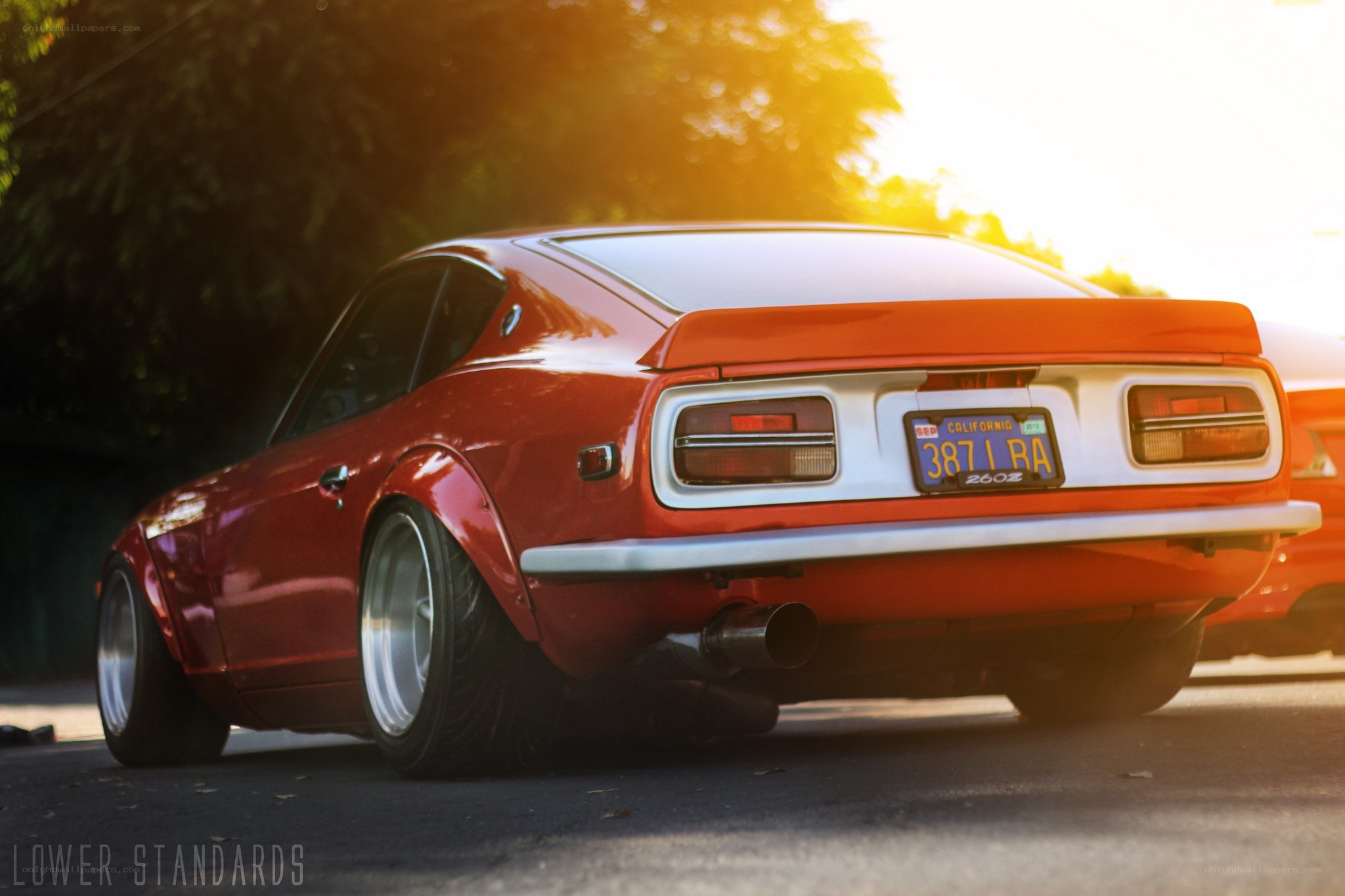 Red Datsun 240Z at sunset