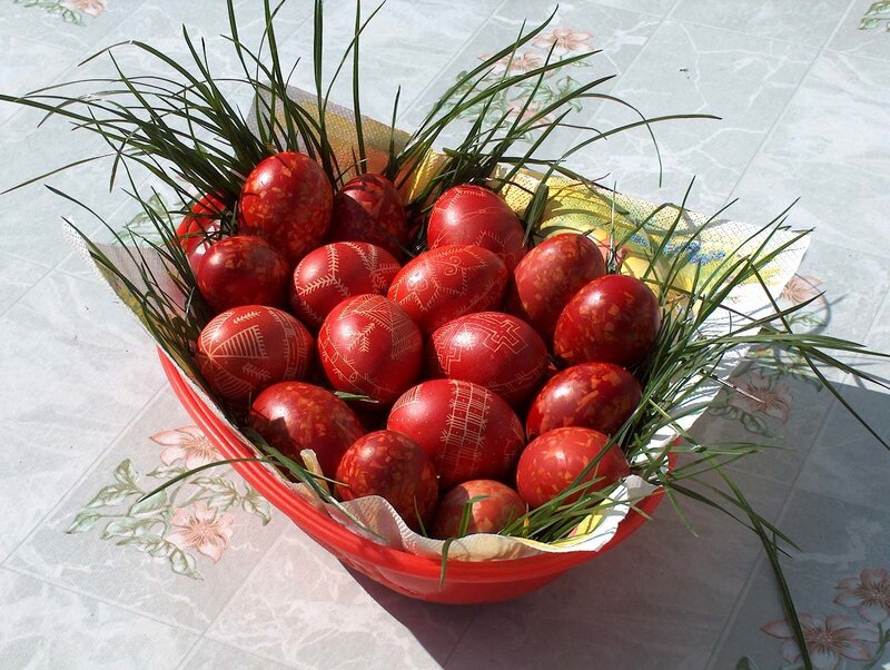 Red decorated Easter eggs in a basket
