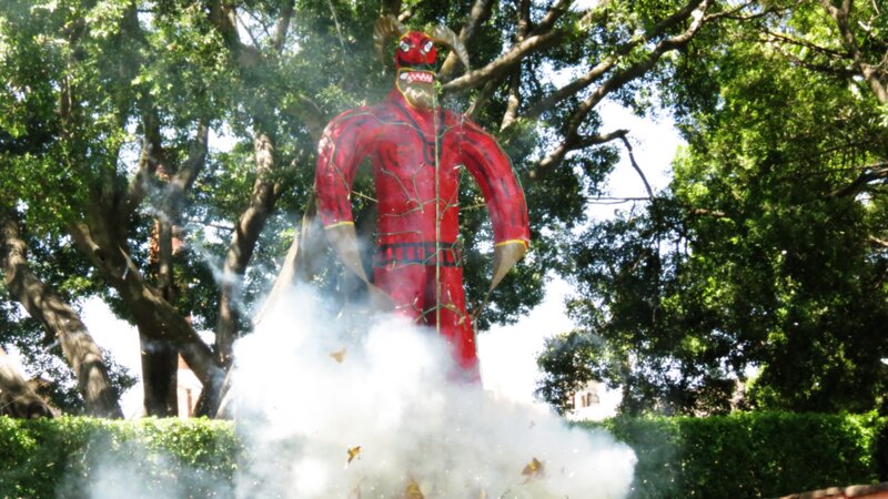 Red demon effigy burning