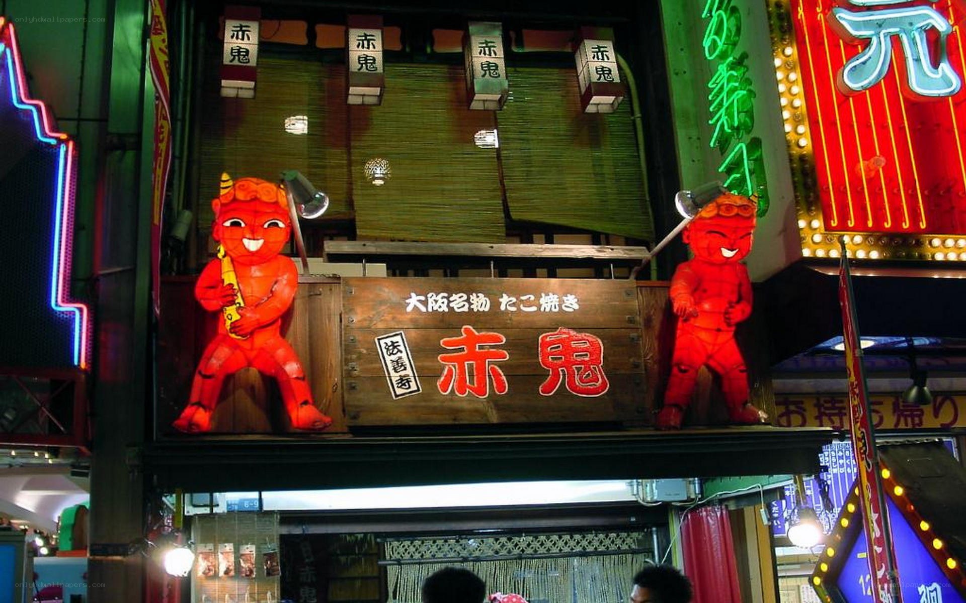 Red devil statues at a Japanese restaurant