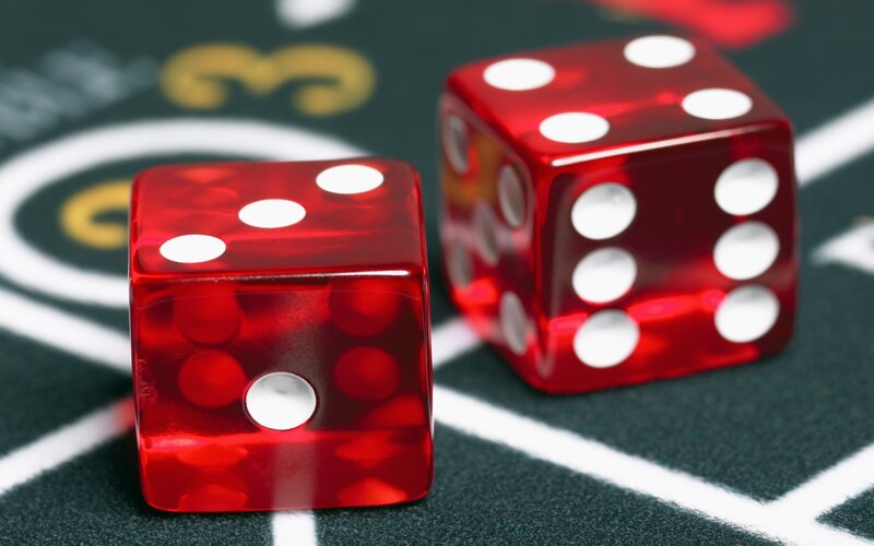 Red dice on a gaming table