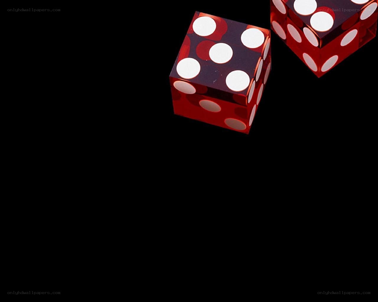 Red dice on black background