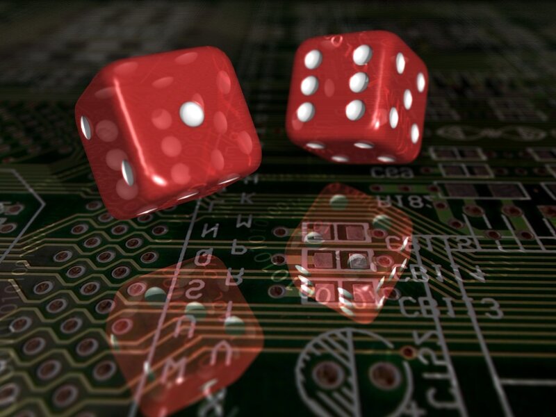 Red dice on circuit board