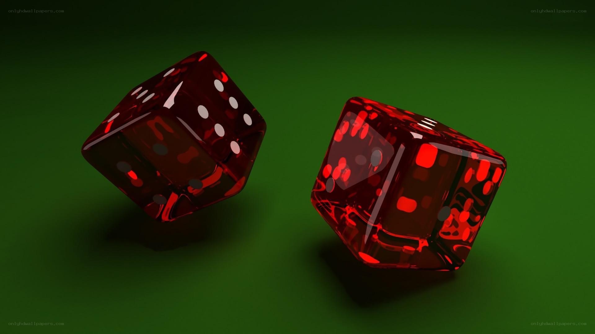 Red dice on green surface