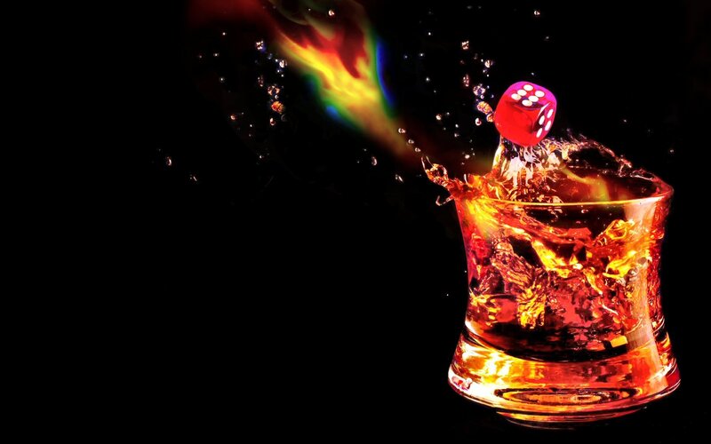 Red Die in Whiskey Glass