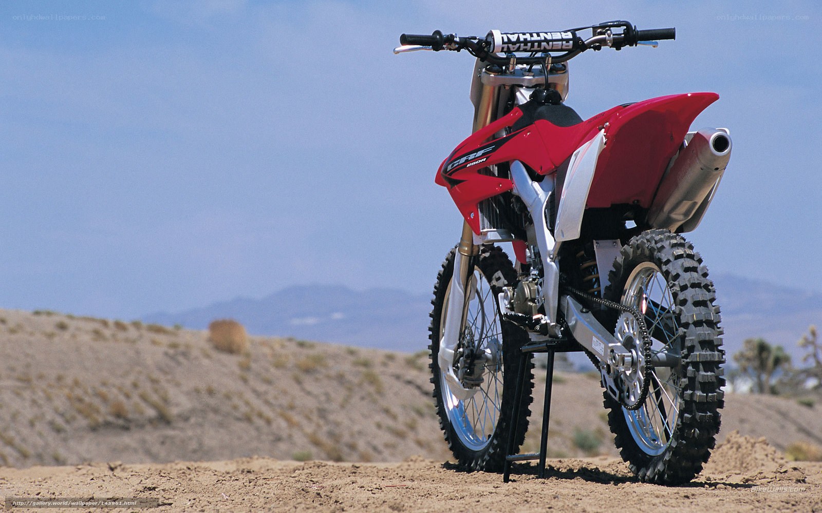 Red dirt bike in desert