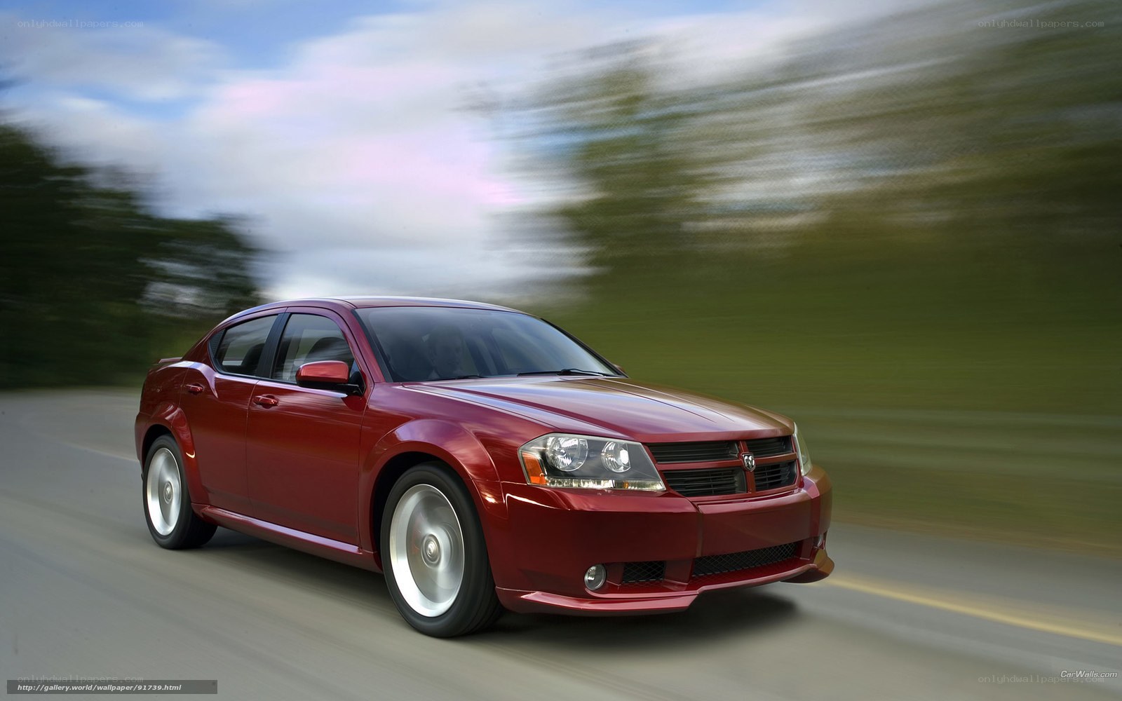 Red Dodge Avenger in motion