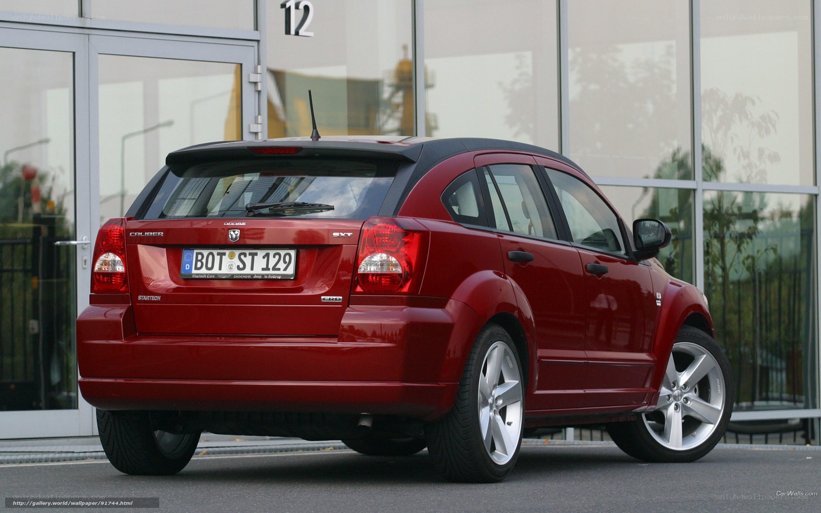 Red Dodge Caliber parked outside