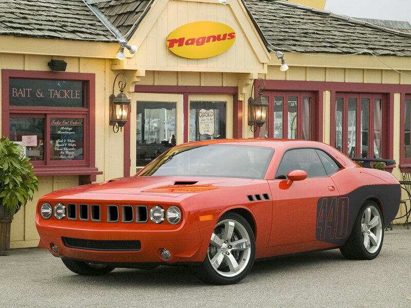 Red Dodge Challenger in front of Magnus