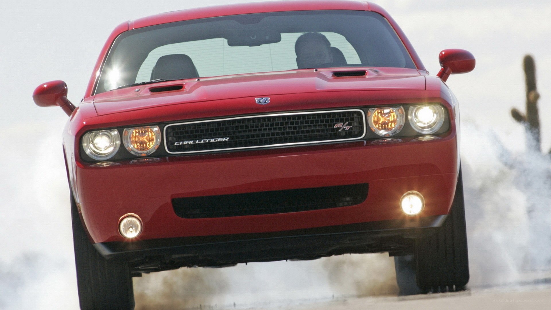 Red Dodge Challenger in motion