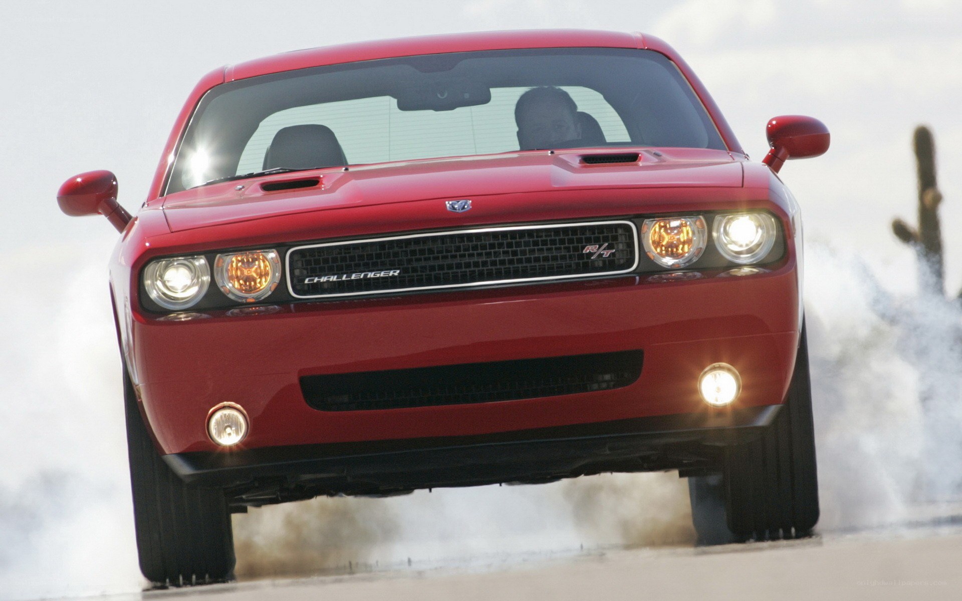Red Dodge Challenger in motion