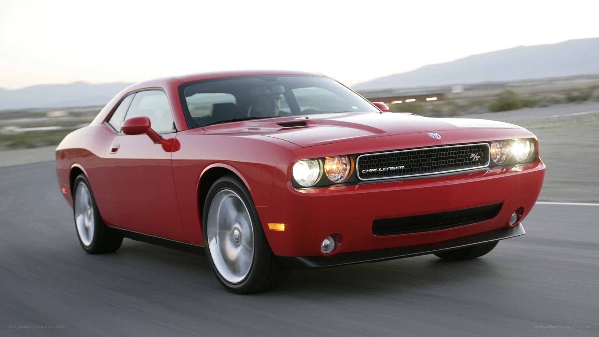 Red Dodge Challenger in motion