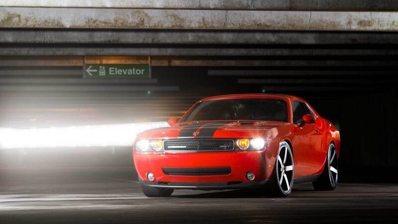 Red Dodge Challenger in parking garage