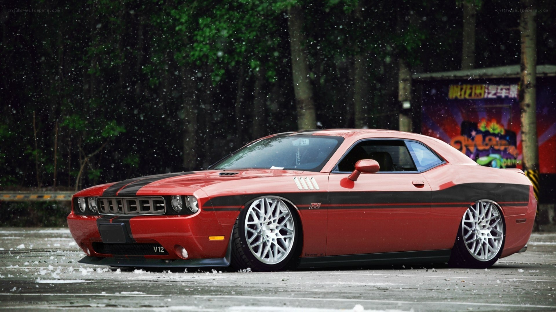 Red Dodge Challenger in snow