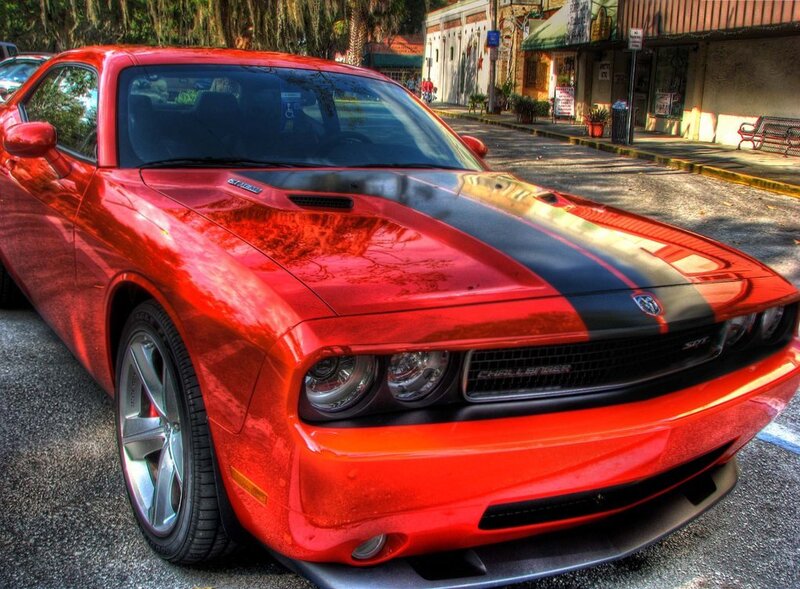 Red Dodge Challenger on a city street