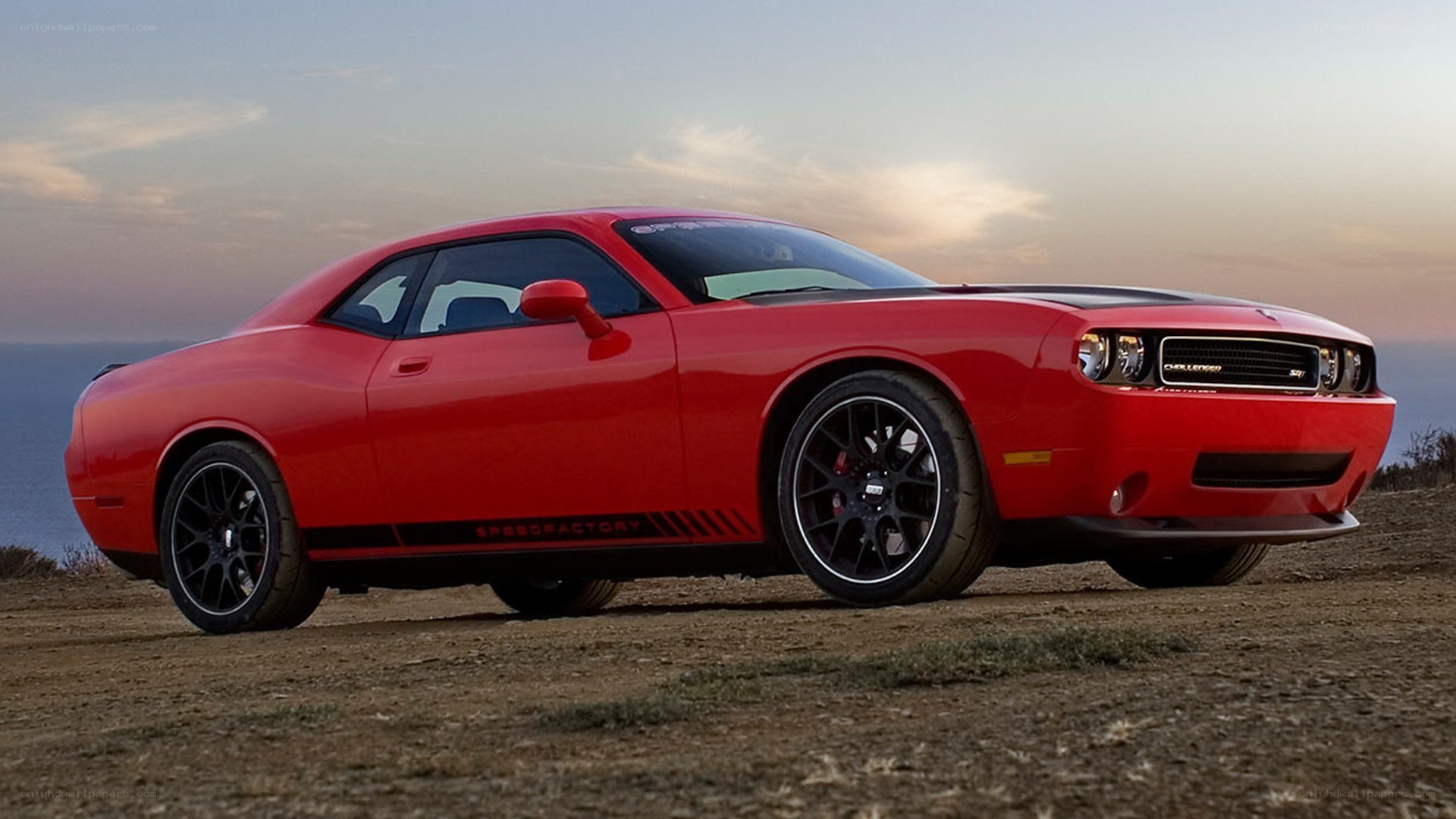 Red Dodge Challenger on cliff